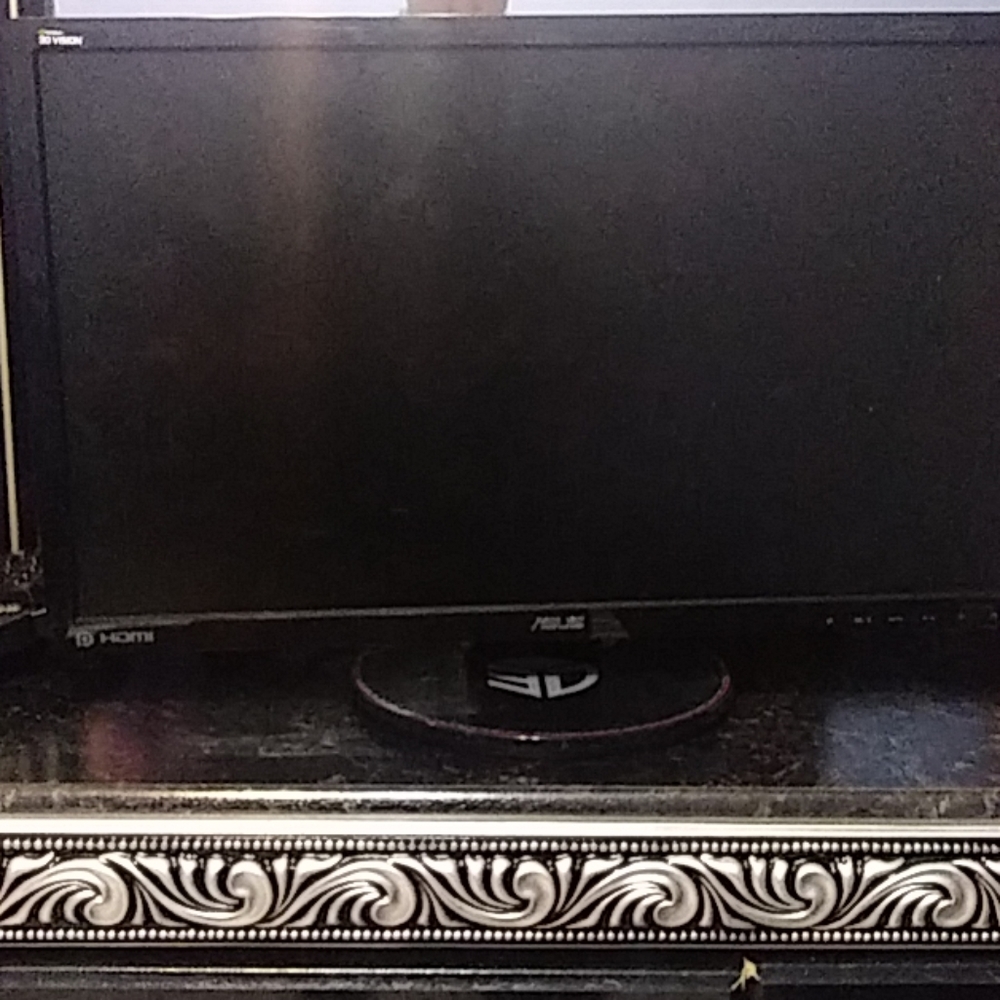 A monitor with half keyboard and hdmi cable